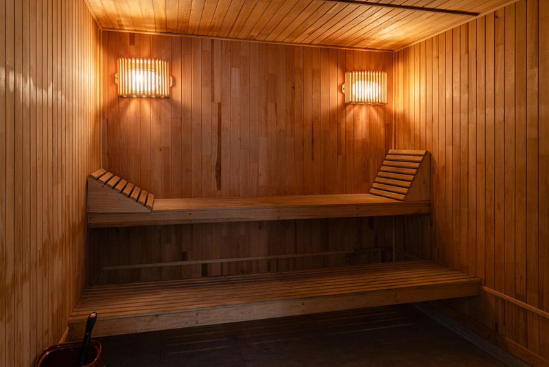 Warm, inviting sauna interior with soft lighting and a bright, uplifting feel.