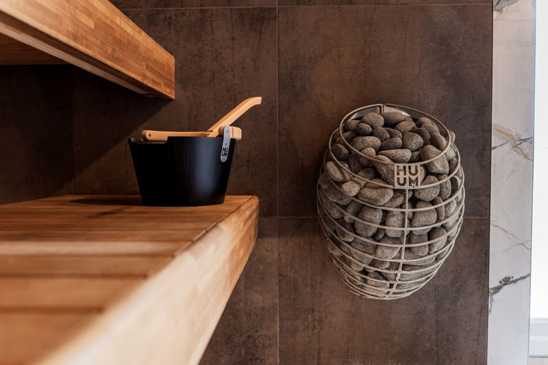 Modern Nordic sauna interior with clean wooden elements and calm lighting.