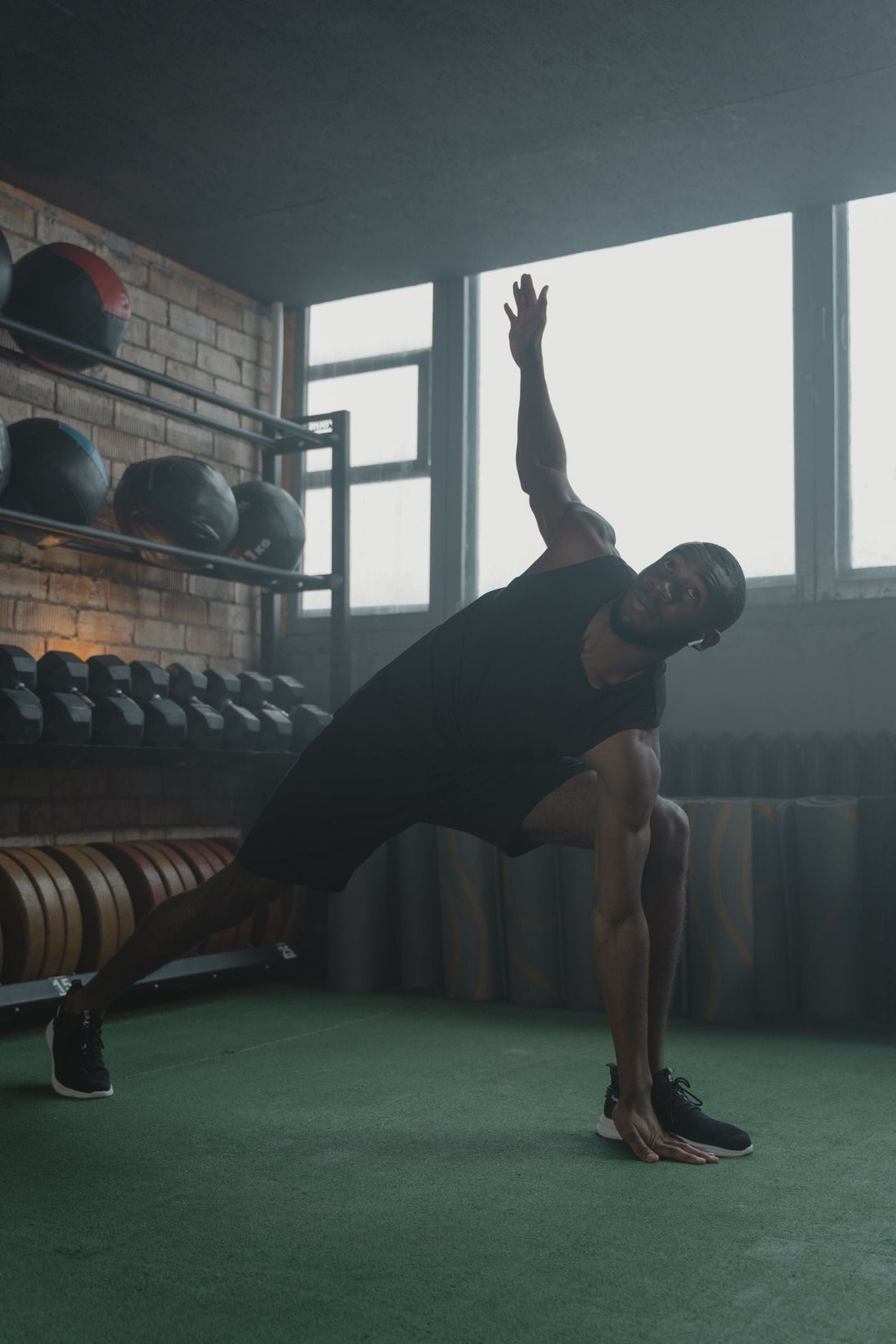 Athletic person stretching, representing training recovery and heat therapy.