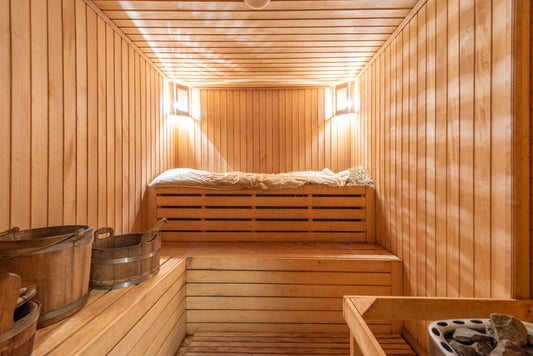 Calm bedroom at dusk, representing sauna use for better sleep quality.