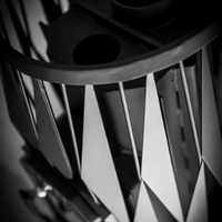 Close-up of a motorcycle exhaust system with geometric design