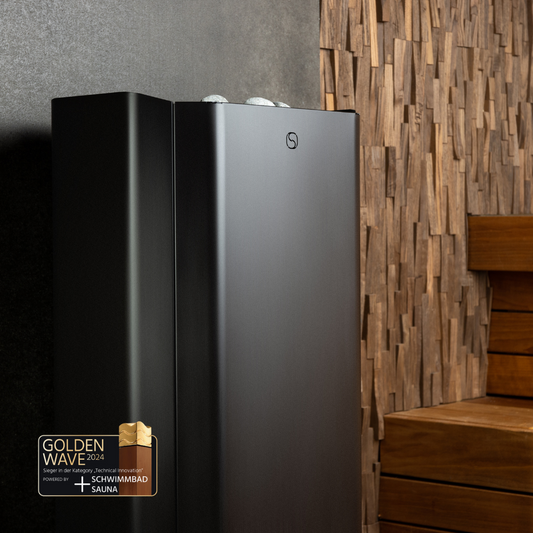 A modern black sauna heater with a touchscreen interface, located in a room with wooden walls and stairs in the background.
