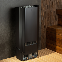 Tall black sauna heater filled with gray stones, set against textured dark and wooden walls. Wooden steps on the right, evoking a warm, serene ambiance.