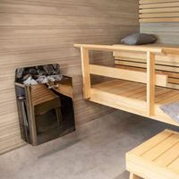 Wooden sauna interior with benches and a cabinet.