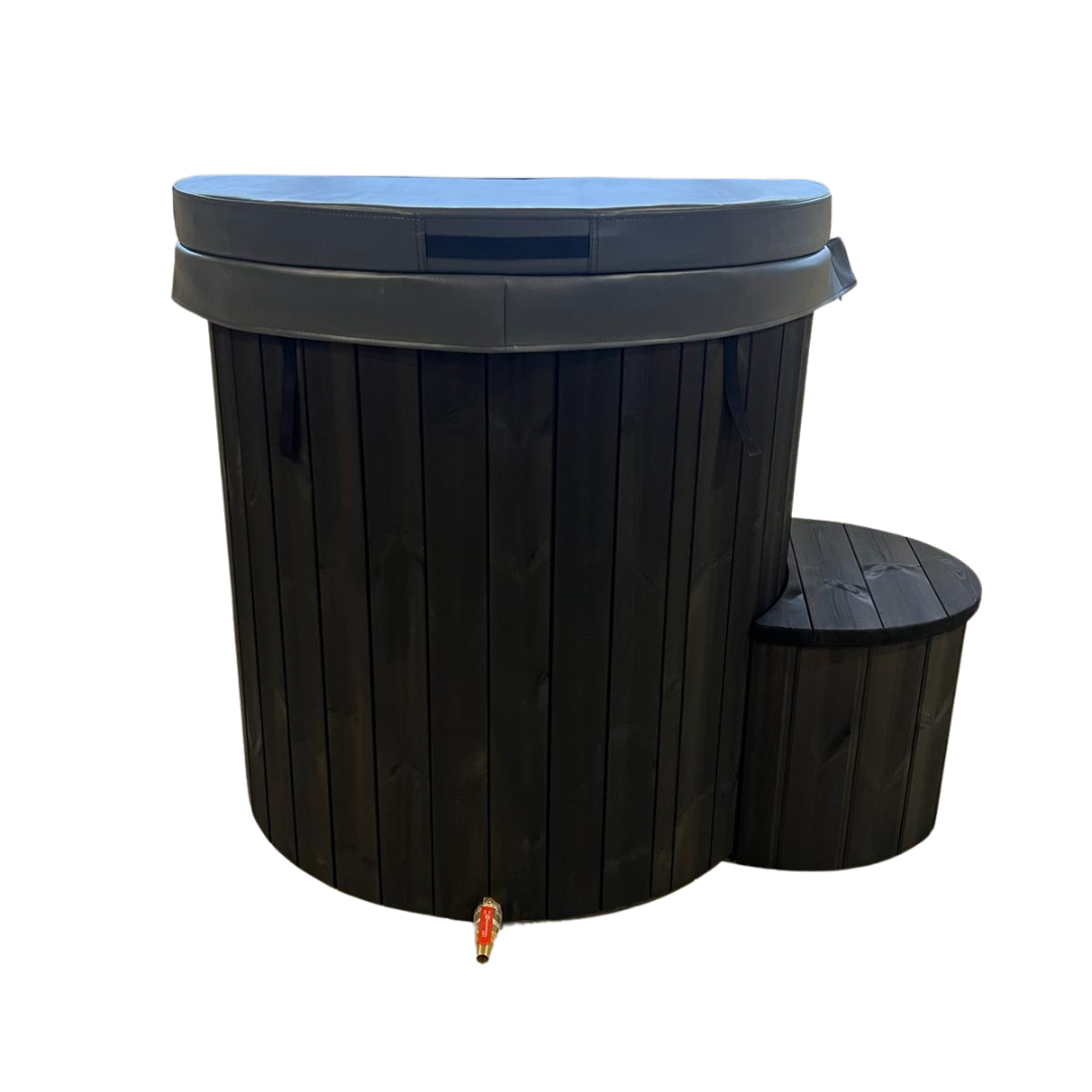 Dark wooden hot tub with a circular design and closed lid, accompanied by a matching wooden step. The faucet is at the base against a black background.