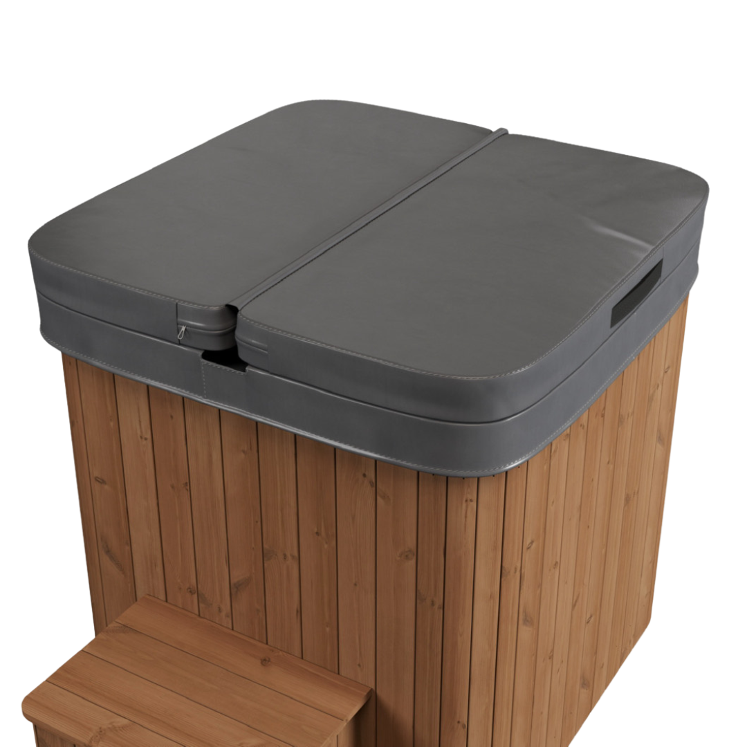 Wooden hot tub with a closed, gray padded cover and small wooden steps. The black background accentuates its neat and cozy design.