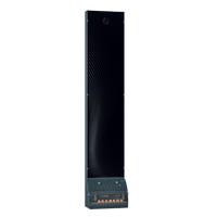 Tall, sleek, dark tower speaker against a black background, featuring dotted patterns on the front, and a modern, minimalist design.